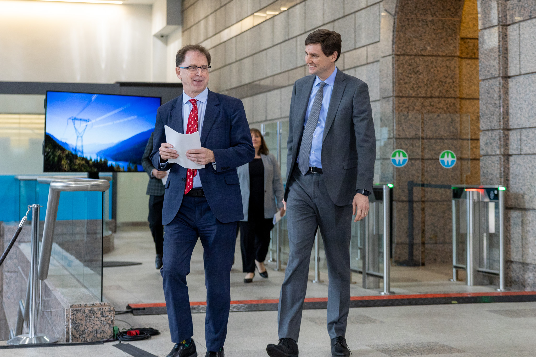 B.C. Premier David Eby and Energy Minister Adrian Dix chat ahead of announcing nine new wind projects in B.C. 