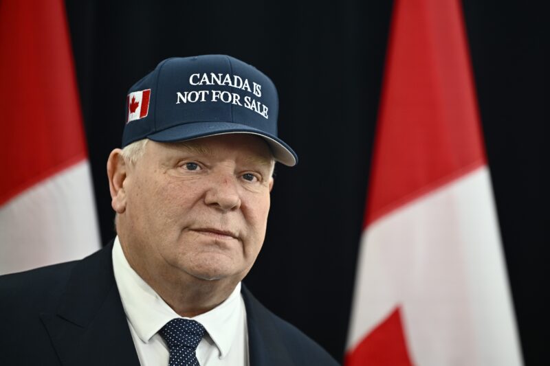 Ontario Premier Doug Ford, wearing a 'Canada Is Not For Sale' hat, speaks as he arrives for a first ministers meeting in Ottawa on Wednesday, Jan. 15, 2025.