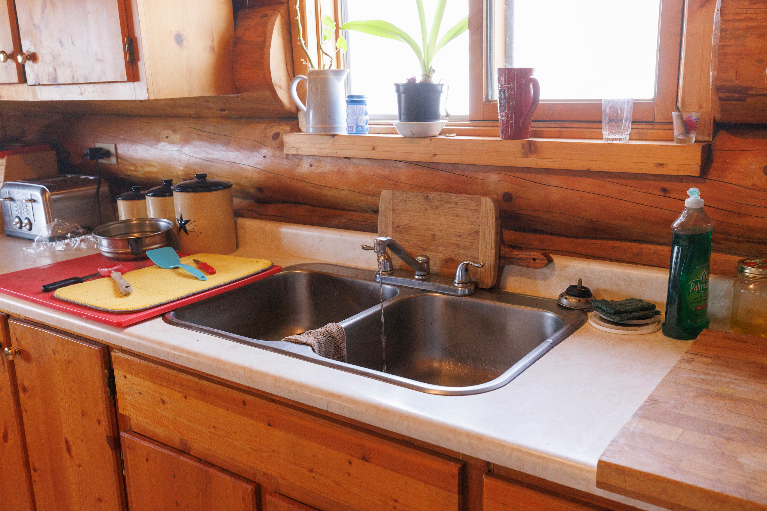 Only a trickle of water comes from a kitchen tap on Dead Horse Creek Ranch following an earthquake