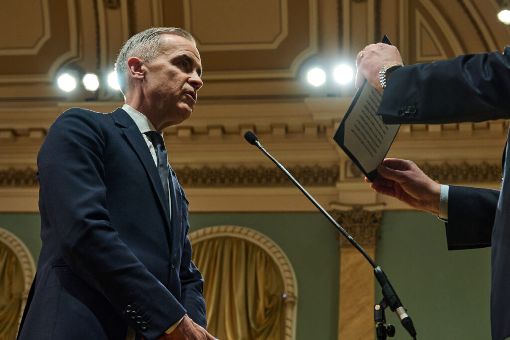 Prime Minister Mark Carney is sworn in as the 24th prime minister of Canada at Rideau Hall in Ottawa on March 14, 2025, taking the oath of office before Governor General Mary Simon.