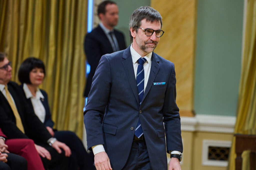 Culture and Identity, Parks Canada Minister Steven Guilbeault rises to take the oath of office for his new position in the federal cabinet of Prime Minister Mark Carney at Rideau Hall in Ottawa on March 14, 2025.