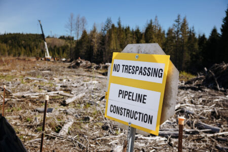 Sign that reads "No trespassing pipeline construction"