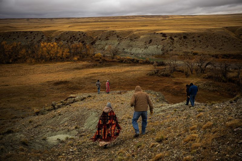 Members of the Blackfoot Confederacy and select outsider walk down to the edge of a traditional bison drive site on the Blackfeet Reservation in Montana, on October 21, 2024.