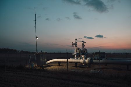 A gas pipeline station at sunset