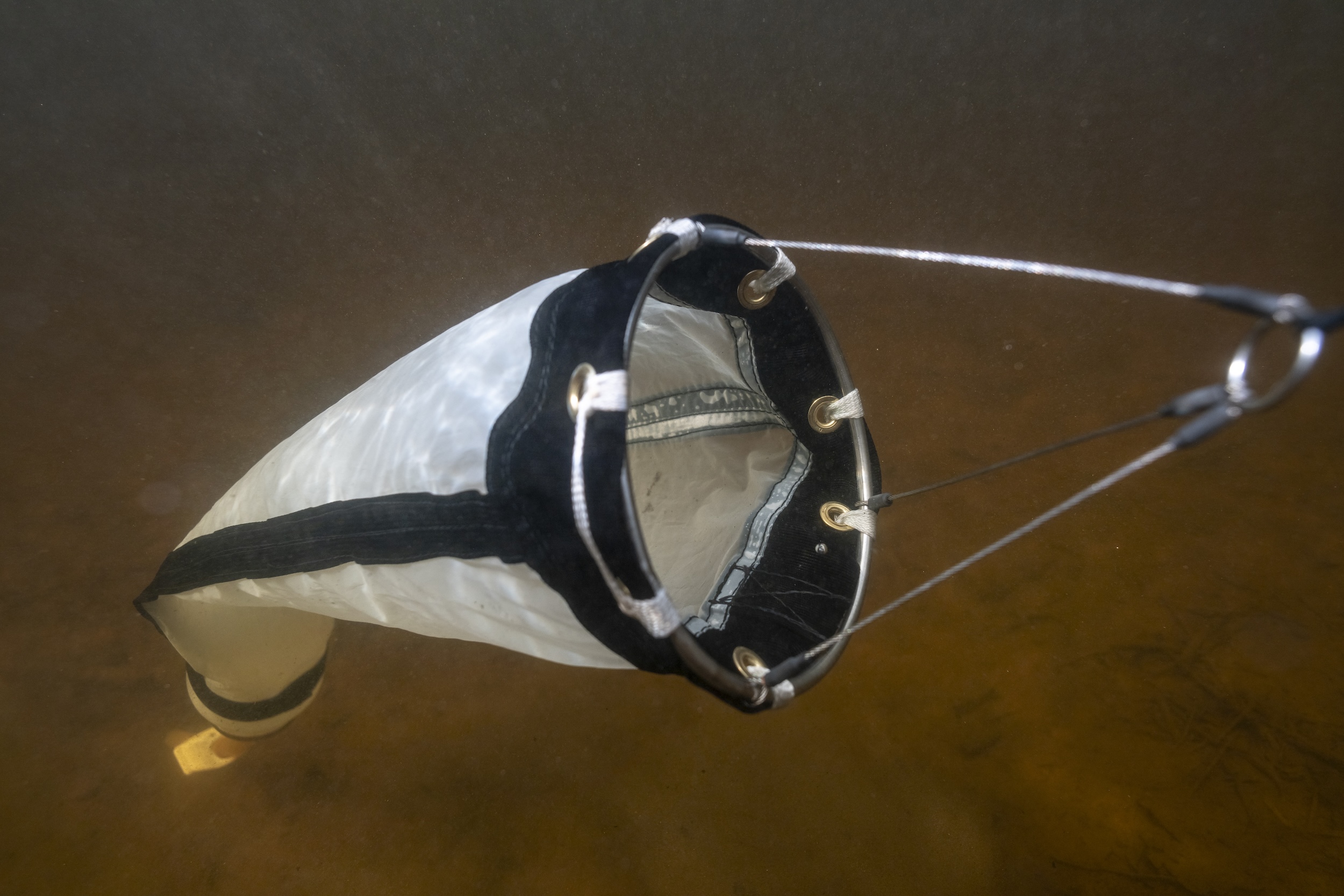 A plankton net submerged in water
