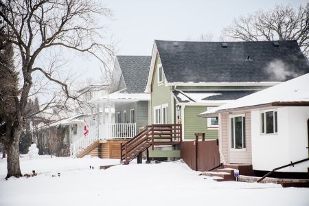 A row of single-family houses in Winnipeg, Man., during a snowy winter.
