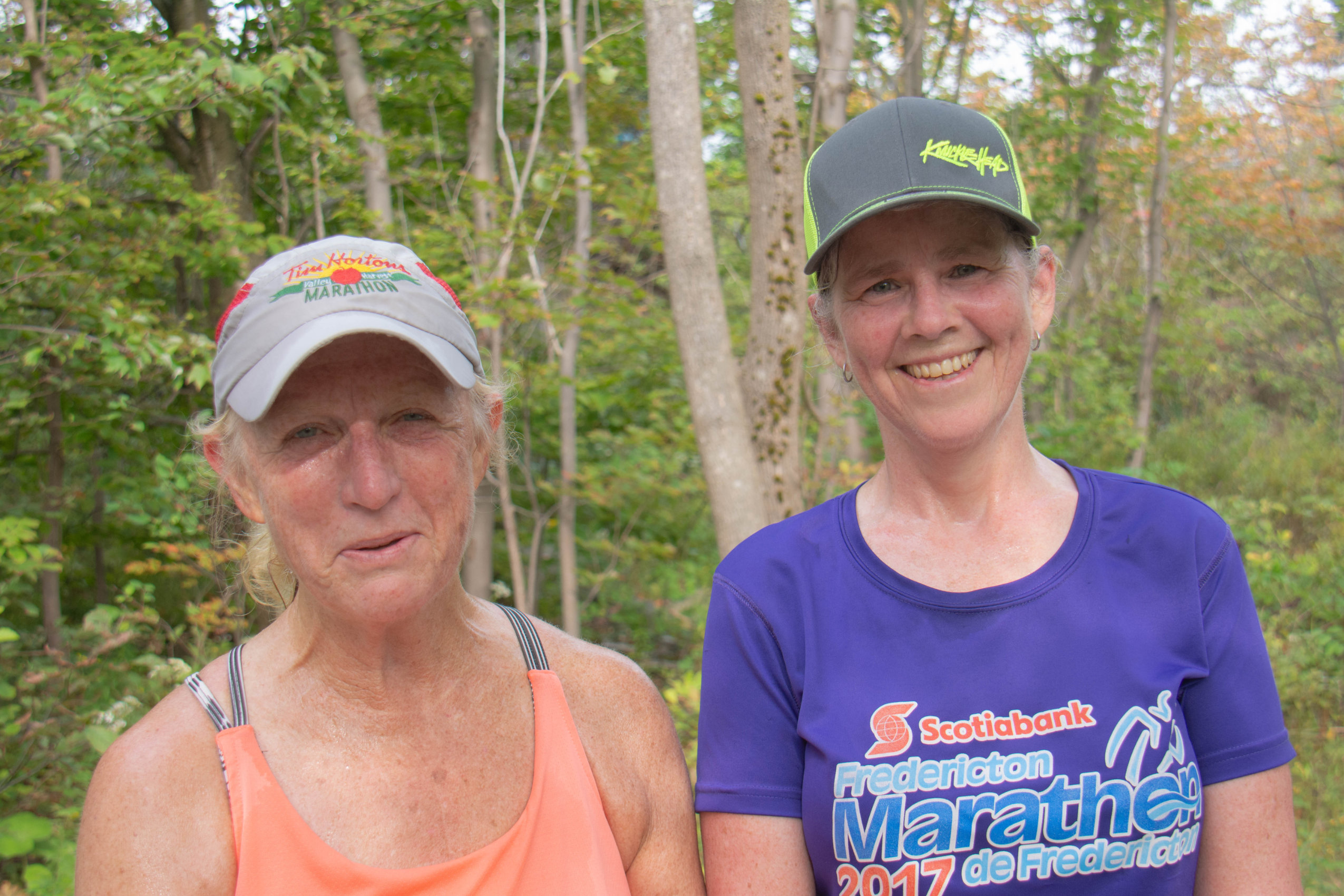 Two women out for a run in Dartmouth's Shubie Park pose for a photo.