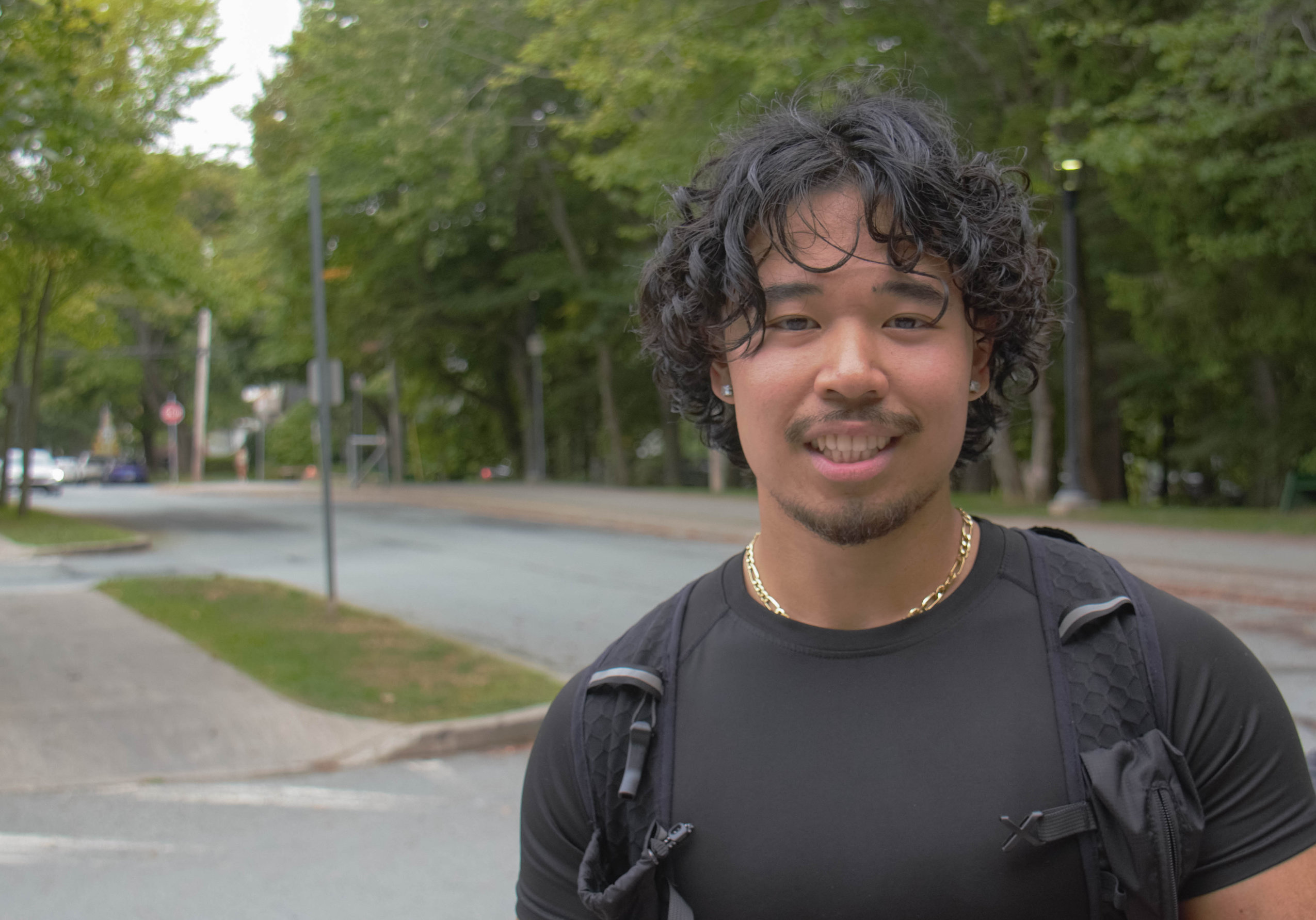 A man poses for a photo in Halifax's Point Pleasant Park, which recently reopened after weeks of closure due to the Nova Scotia government's woods ban.