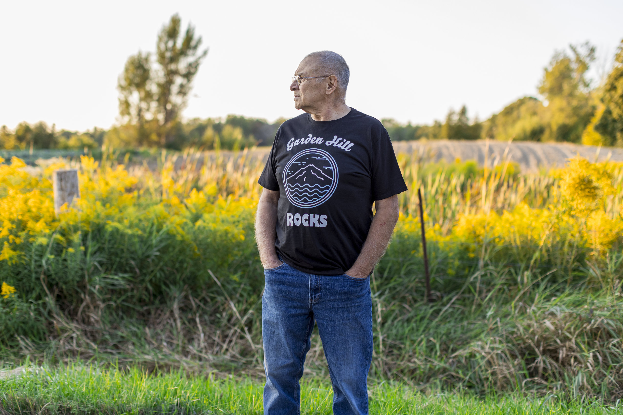 Richard Yoshida, a resident of Garden Hill, Ont., poses for a portrait in front of the proposed site for a new housing development.