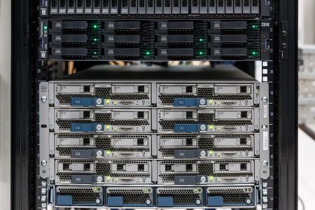 Close view of a server rack stacked with computers