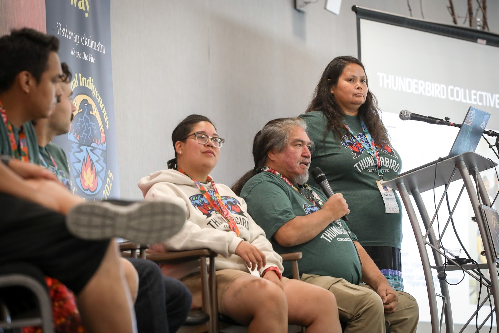 Joe Gilchrist and other Indigenous firekeepers and organizers speak on a panel.