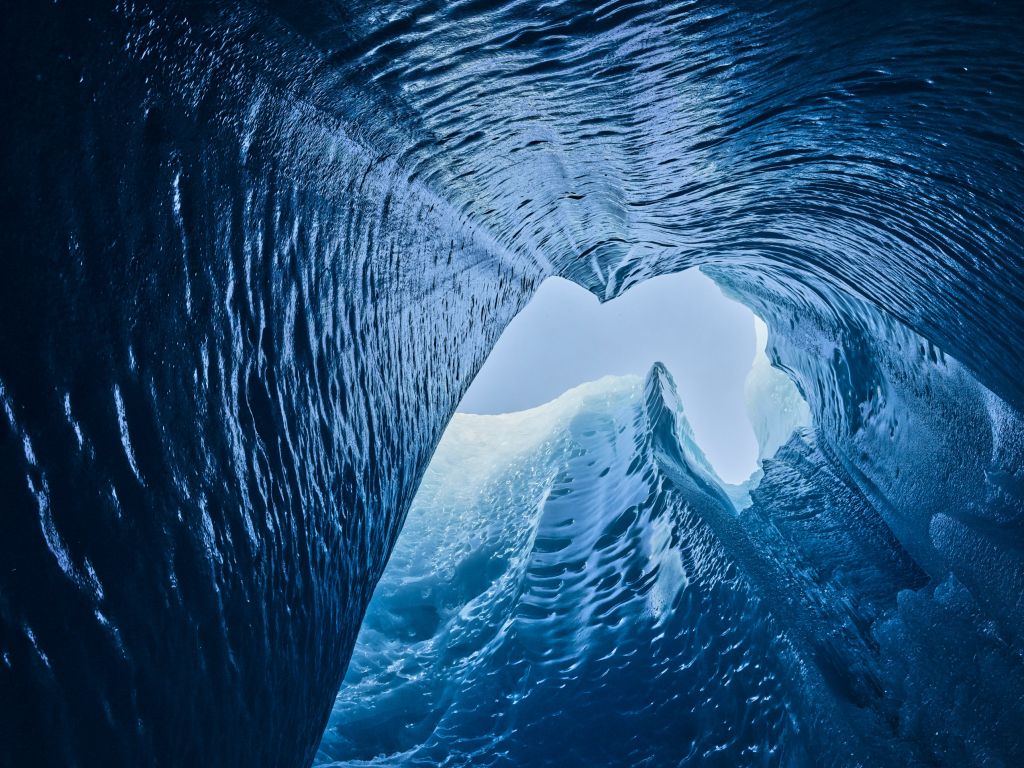a detailed photo of a glacier from below which shows all the different parts of the ice
