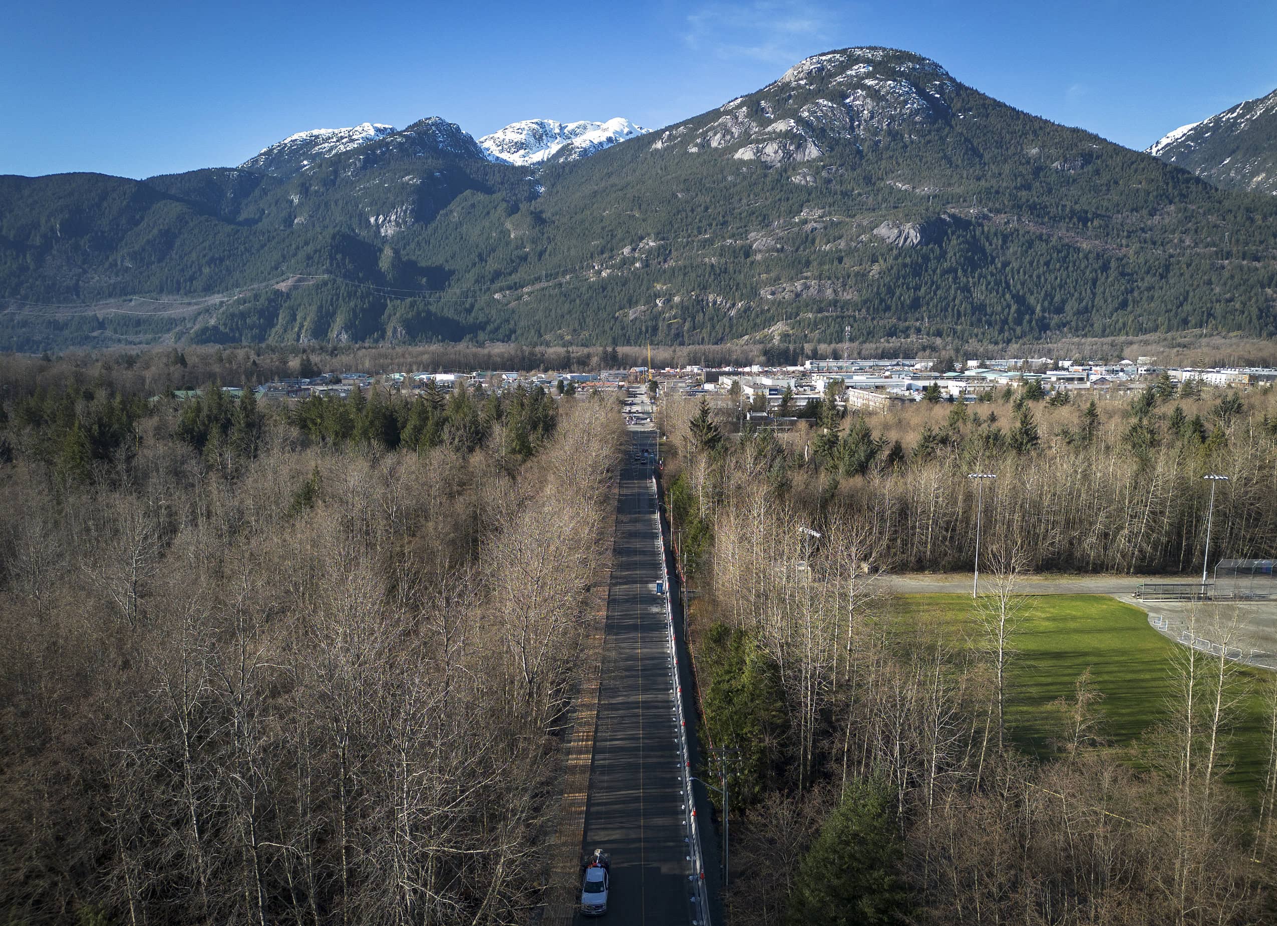 An aerial view of Finch Drive in Squamish, B.C., with mountains in the background.