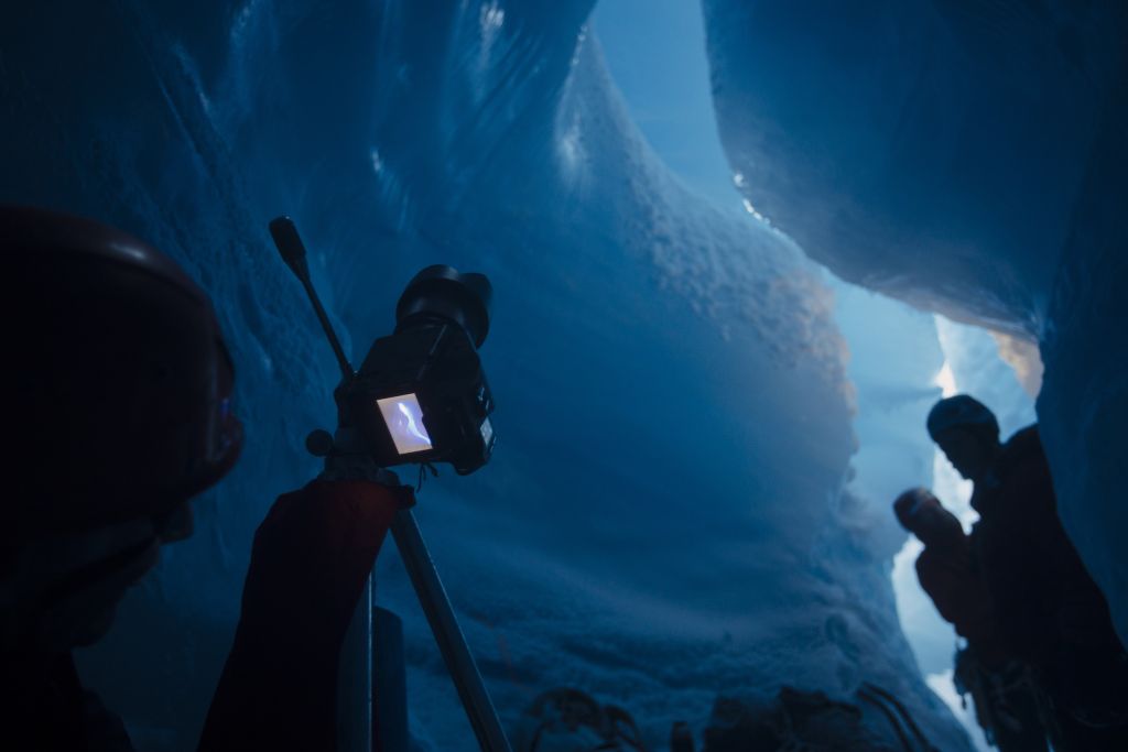 Inside a melting glacier, photographers race to capture what remains