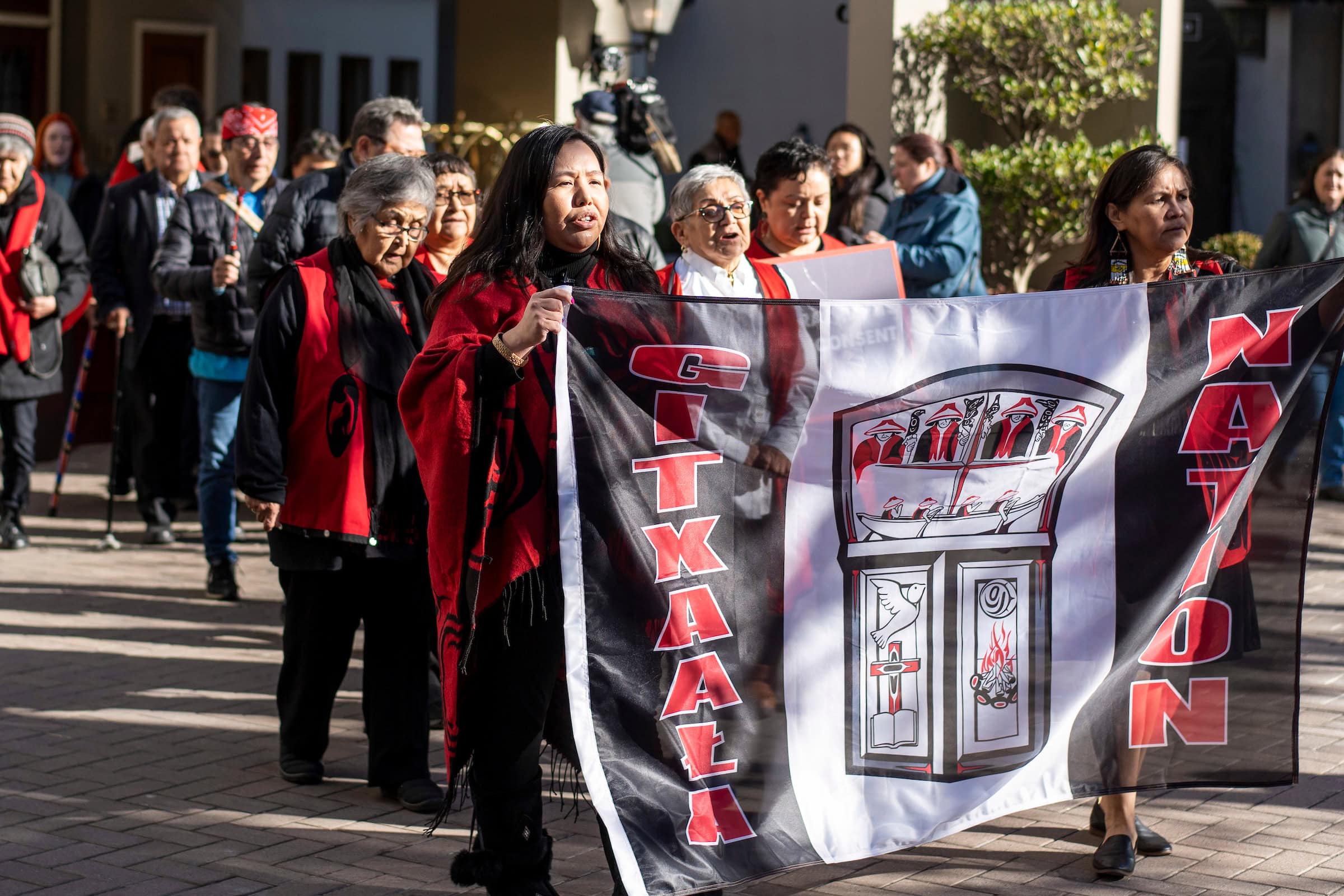 A procession by the Gitxaala Nation walking to the B.C. Supreme Court.