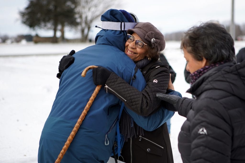 Ken Johnston (L) embraces Barbara G. Carter, the great great grand-daughter of freedom seeker Josiah Henson, at the Josiah Henson Museum of African-Canadian History on the Dawn Settlement after he arrives in Dresden, Ont., while retracing an Underground Railroad route from Detroit to Dresden on his Walk to Freedom, January 2, 2026. Canice Leung for The Narwhal