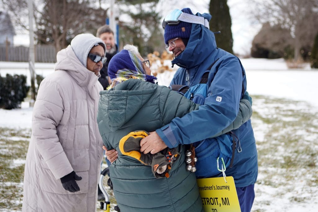 Ken Johnston embraces a descendant of freedom seekers after arriving at the Josiah Henson Museum of African-Canadian History on the Dawn Settlement in Dresden, Ont., while retracing an Underground Railroad route from Detroit to Dresden on his Walk to Freedom.