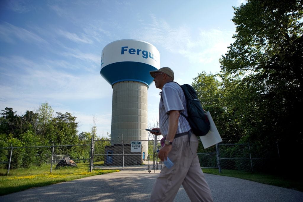 Ken Johnston walks through Fergus, Ont., while retracing an Underground Railroad route from Niagara Falls to Owen Sound on his Walk to Freedom.