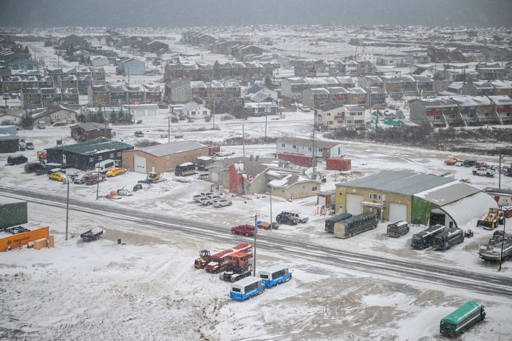 An aerial view of Churchill, Man., with a light snow falling.