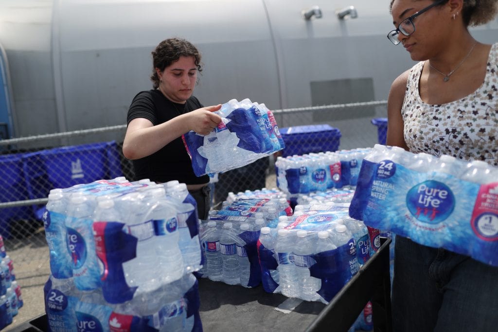 Volunteers drop off water at a respite site during a heatwave in Toronto, Ontario.