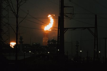 A towering orange flame lights up the night sky at LNG Canada's facility in Kitimat, B.C., Canada