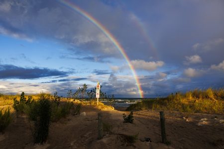 A double rainbow stretches across the sky at Wasaga Beach in Ontario.