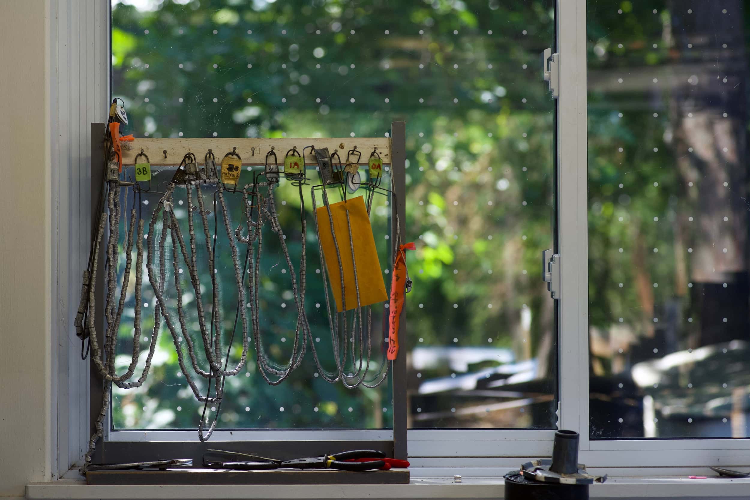 Ropes used for bird banding hanging on a display.