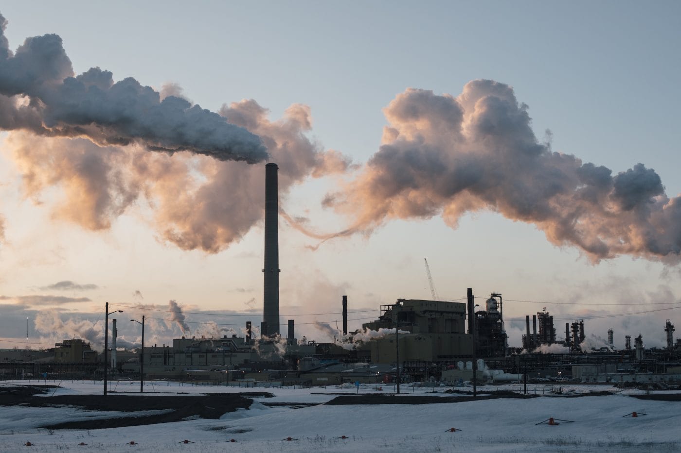 Smoke billows out of smokestacks at the Syncrude Mildred Lake upgrader north of Fort McMurray, Alberta.