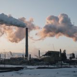 Smoke billows out of smokestacks at the Syncrude Mildred Lake upgrader north of Fort McMurray, Alberta.