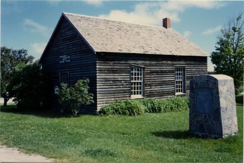 An archival colour image of a wood-frame 19th-century church.