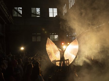 Drag artist Homo Hardware spreads a pair of wings attached to their arms during a performance at the Britannia Mine Museum in Britannia Beach, B.C.