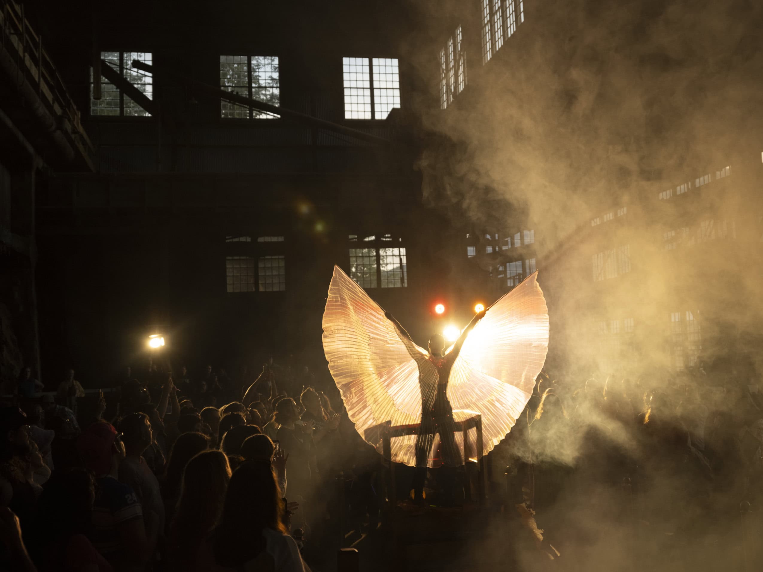 Drag artist Homo Hardware spreads a pair of wings attached to their arms during a performance at the Britannia Mine Museum in Britannia Beach, B.C.