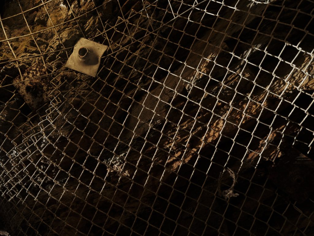 A closeup image of fencing that reinforces the ceiling of a preserved mine shaft at the Britannia Mine Museum in Britannia Beach, B.C.
