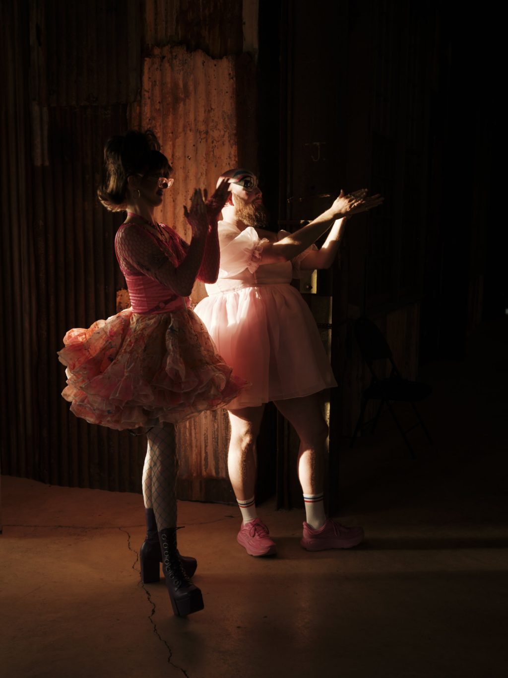 Two drag artists cheer on fellow performers while waiting for their acts to begin during a drag show at the Britannia Mine Museum in Britannia Beach, B.C.