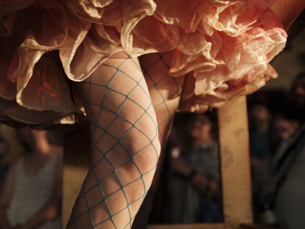 A closeup of green fishnet stockings adorning drag artist Nora Vision's knee during a performance at the Britannia Mine Museum in Britannia Beach, B.C.