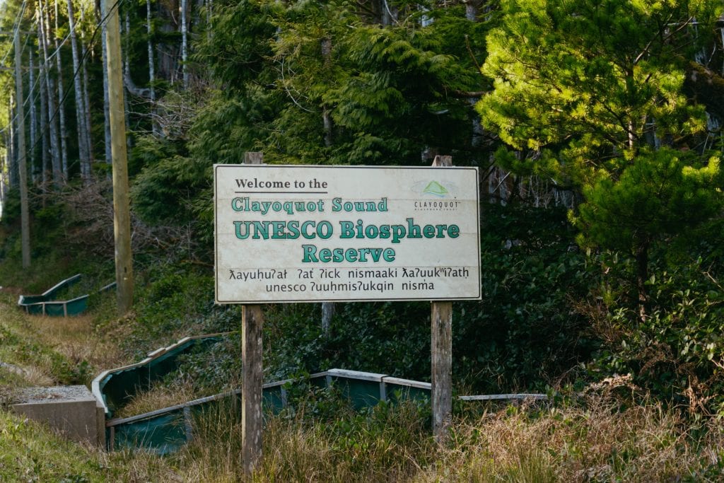 A photo of a sign that says "Welcome to the Clayoquot Sound UNESCO Biosphere Reserve"
