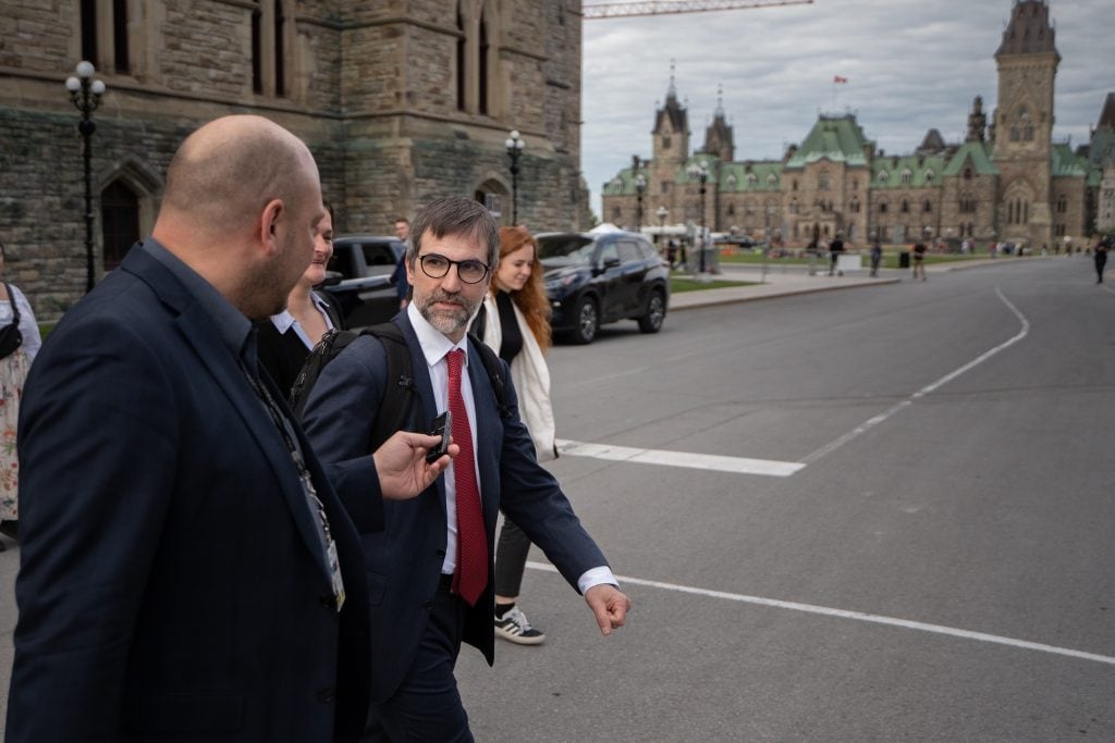 Steven Guilbeault speaks to Narwhal reporter Carl Meyer after announcing his resignation, in Ottawa on May 27, 2026.