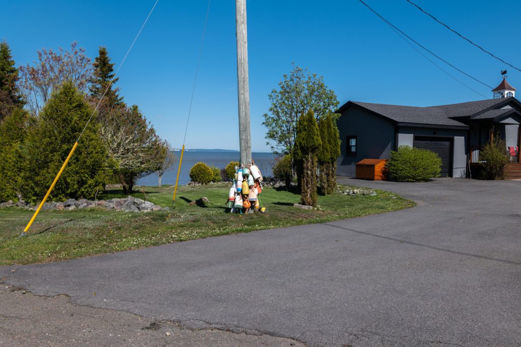 Fishing buoys are hung on a telephone pole in the Saint John, N.B., neighbourhood of Lorneville.