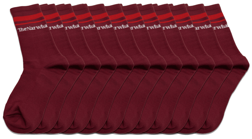 a photo of a dozen or so Narwhal socks stacked horizontally.