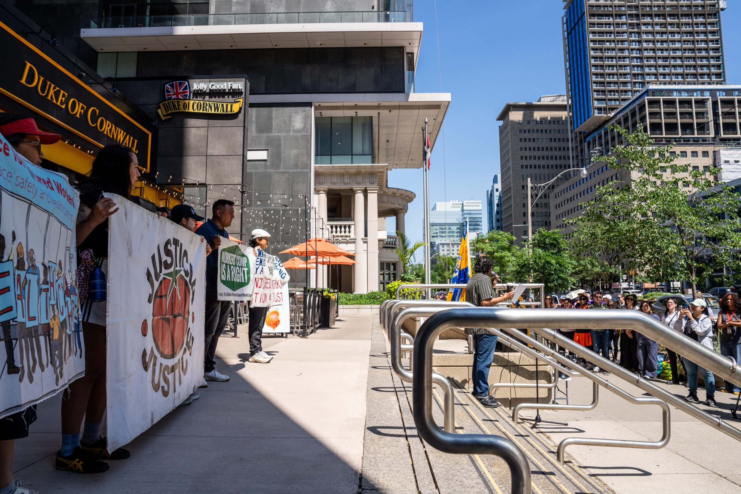 Justice for Migrant Workers (J4MW) Co-Founder, Chris Ramsaroop speaks outside the J4MW rally at the ministry of labour training and skills development building in Toronto Canada on July 24, 2026