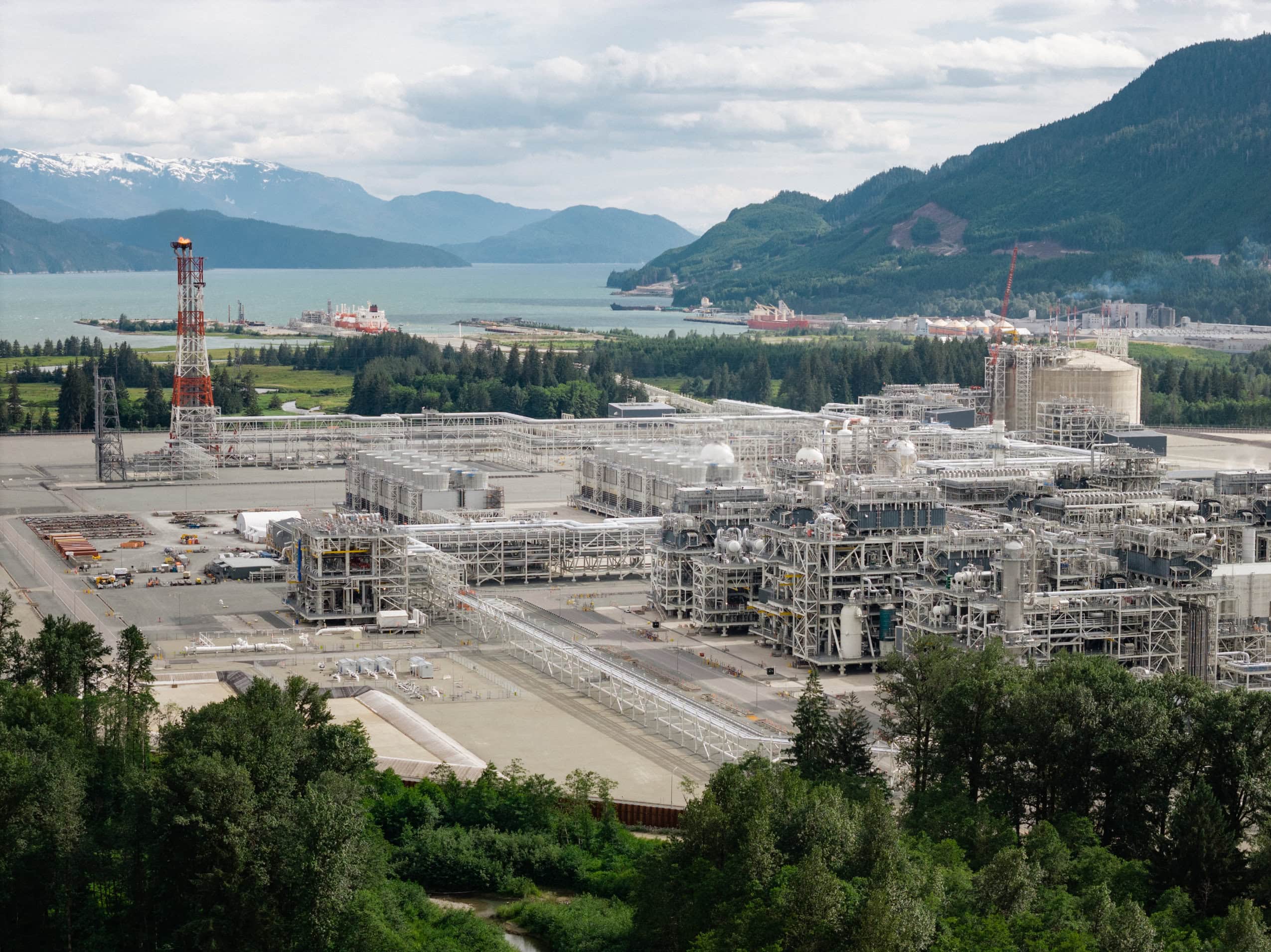 LNG Canada's export terminal sits on the ocean with a tanker in the port.
