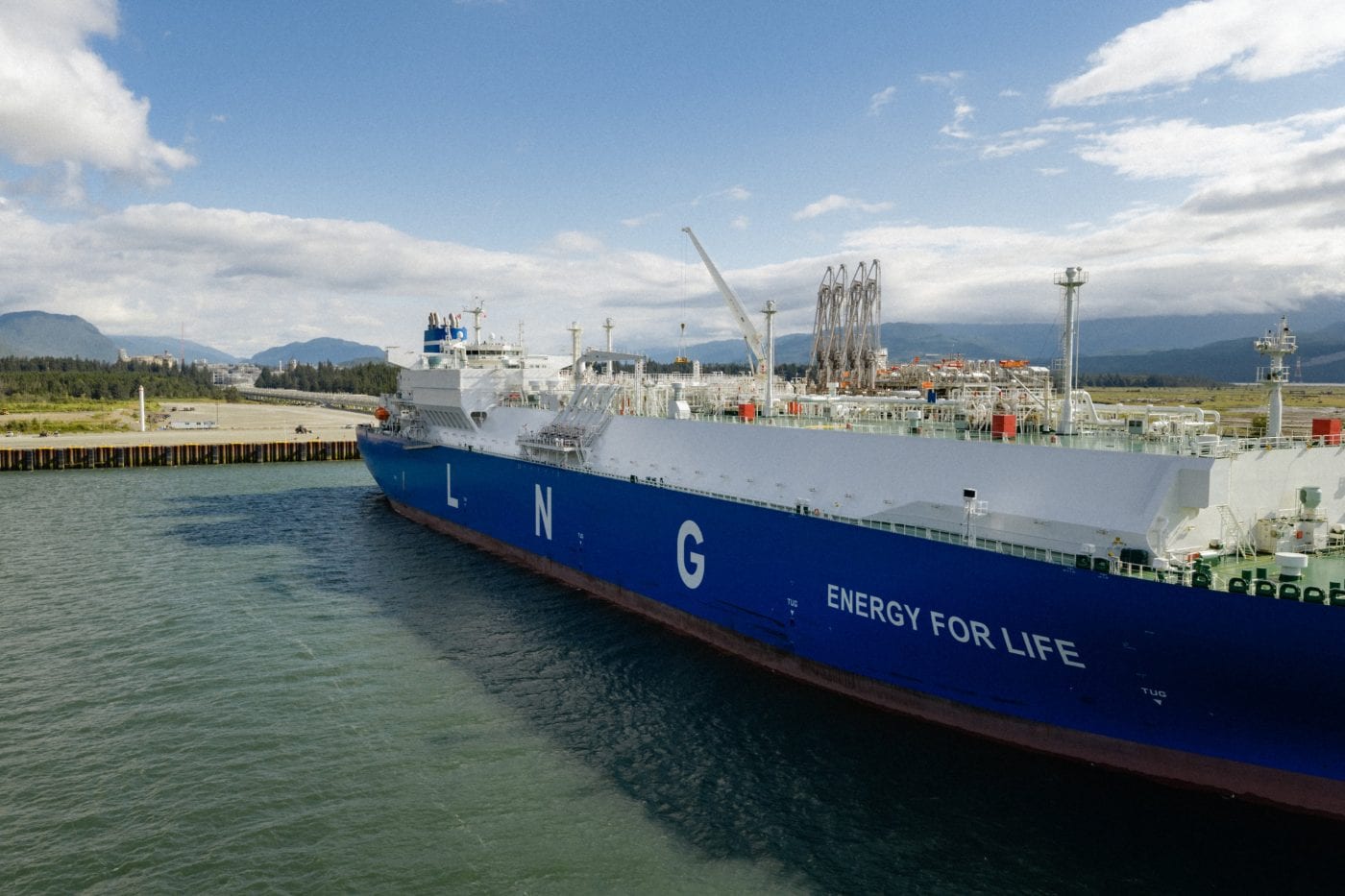 A blue tanker with the words LNG energy for life sits at a dock in Kitimat.