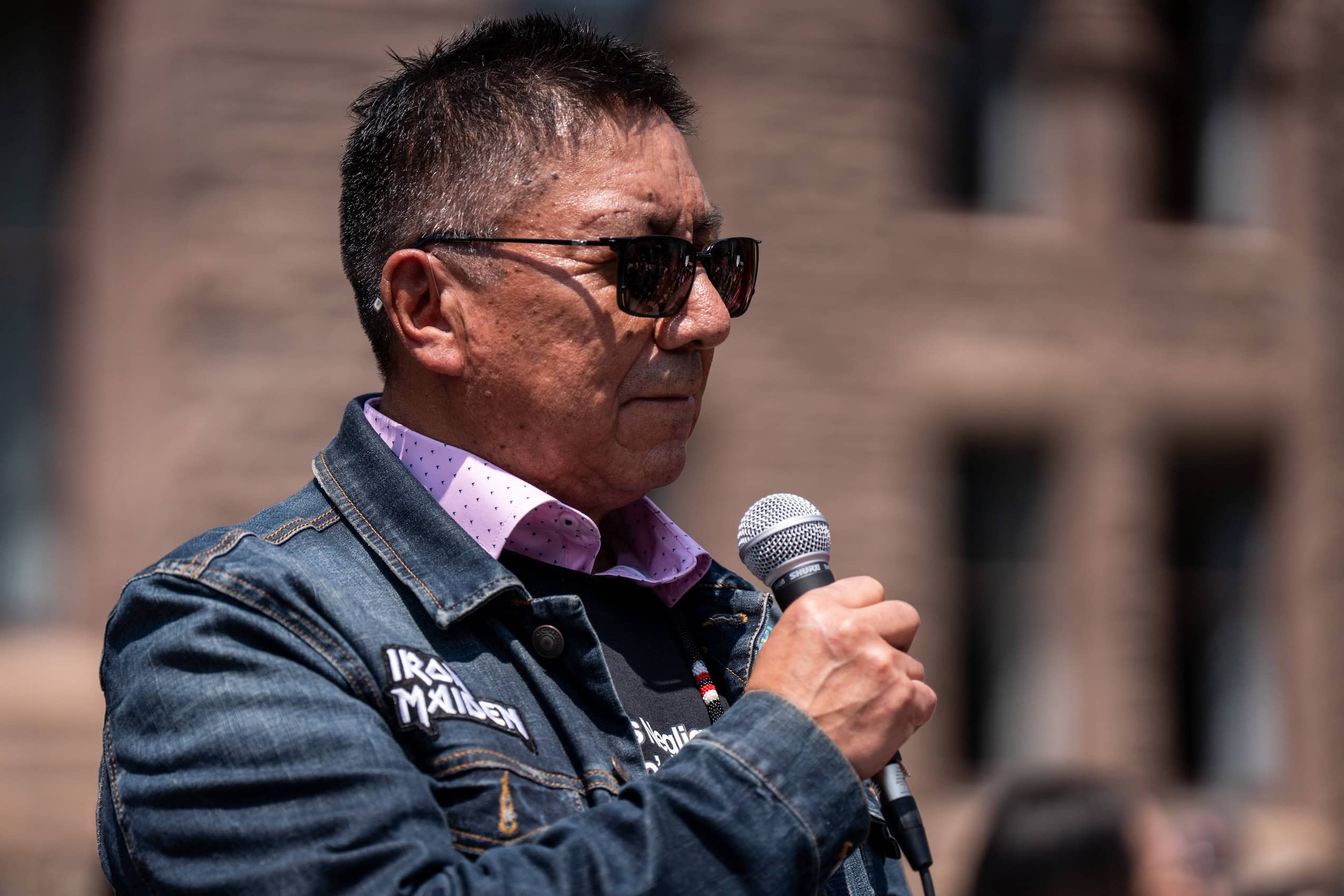 Nishnawbe Aski Nation Grand Chief Alvin Fiddler speaks into a microphone.