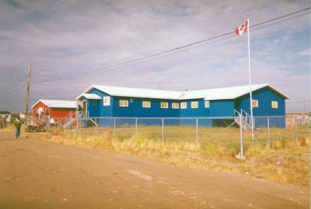 One red building and one blue building in the remote Attawapiskat First Nation