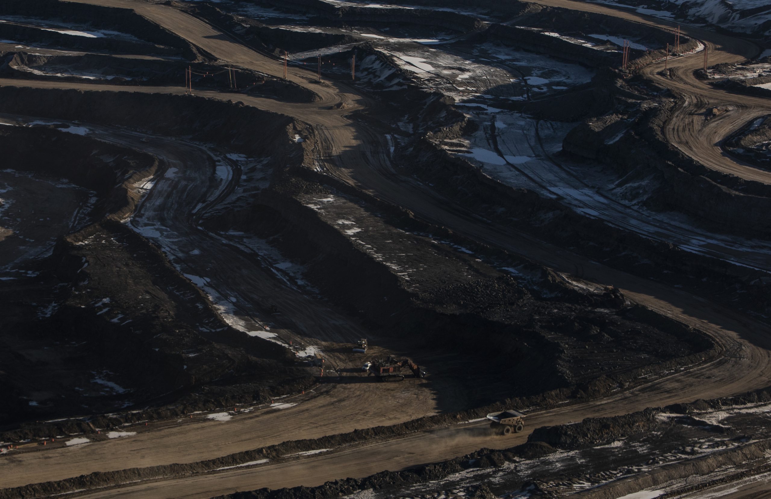 Aerial view of industrial area with heavy trucks.