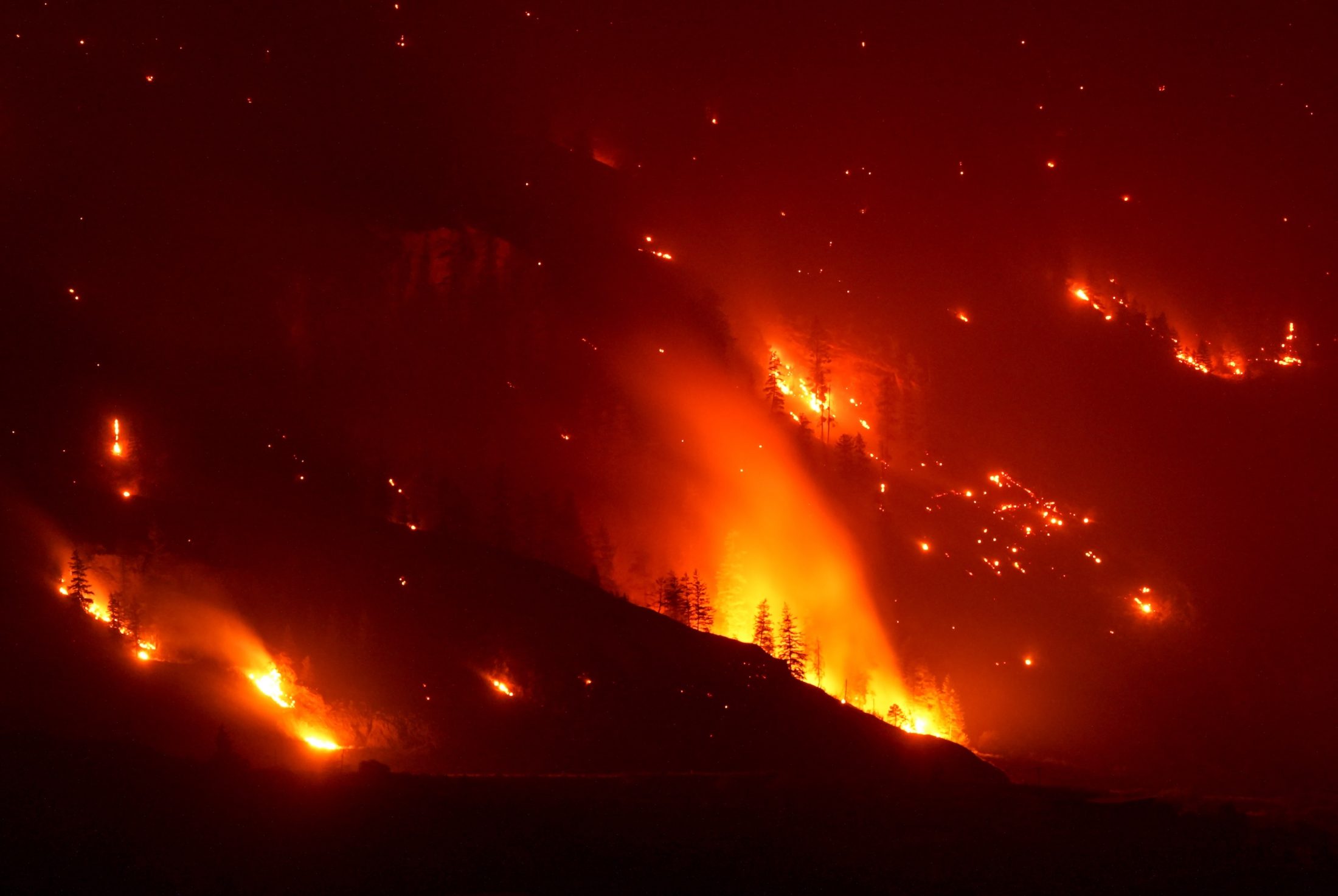 A nightime video of a forest in flames from the Bald Range wildfire, which had forced 20,000 people out of their homes in the south Okanagan region of B.C. by Aug. 8, 2026.