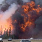 A giant fireball is visible as a wildfire rips through the forest by Highway 63, 16 kilometres south of Fort McMurray, Alta on May 7, 2016. Nearly a year after the massive wildfire that devastated Fort McMurray, Alta., a climate scientist says there may be more forest fires in Canada this summer. "If the forecast's right that it's a warmer than normal summer, we'll probably have more fires," says Mike Flannigan, a meteorologist and professor in the University of Alberta's renewable resources department. THE CANADIAN PRESS/Jonathan Hayward