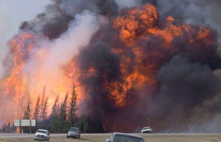 A giant fireball is visible as a wildfire rips through the forest by Highway 63, 16 kilometres south of Fort McMurray, Alta on May 7, 2016. Nearly a year after the massive wildfire that devastated Fort McMurray, Alta., a climate scientist says there may be more forest fires in Canada this summer. "If the forecast's right that it's a warmer than normal summer, we'll probably have more fires," says Mike Flannigan, a meteorologist and professor in the University of Alberta's renewable resources department. THE CANADIAN PRESS/Jonathan Hayward