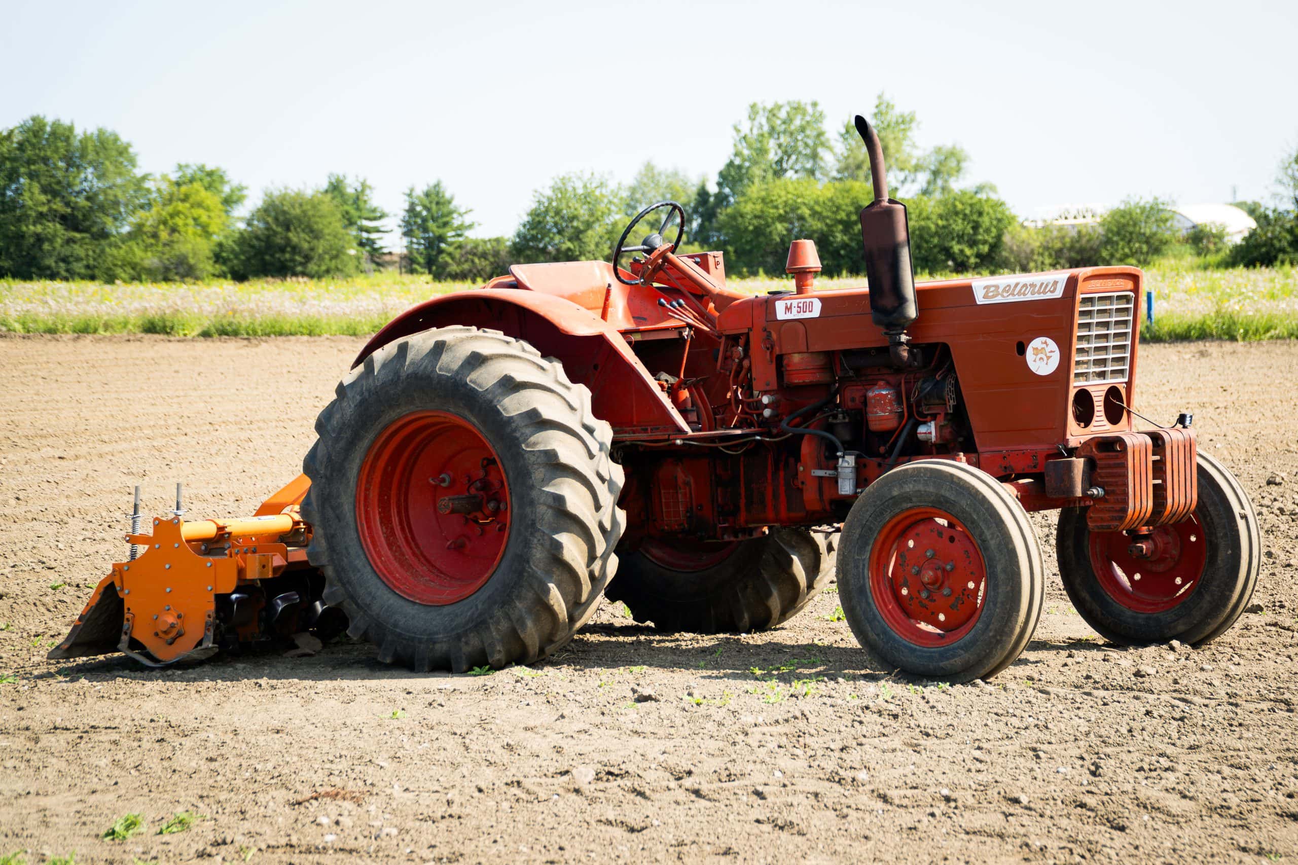 A close up of a red tractor