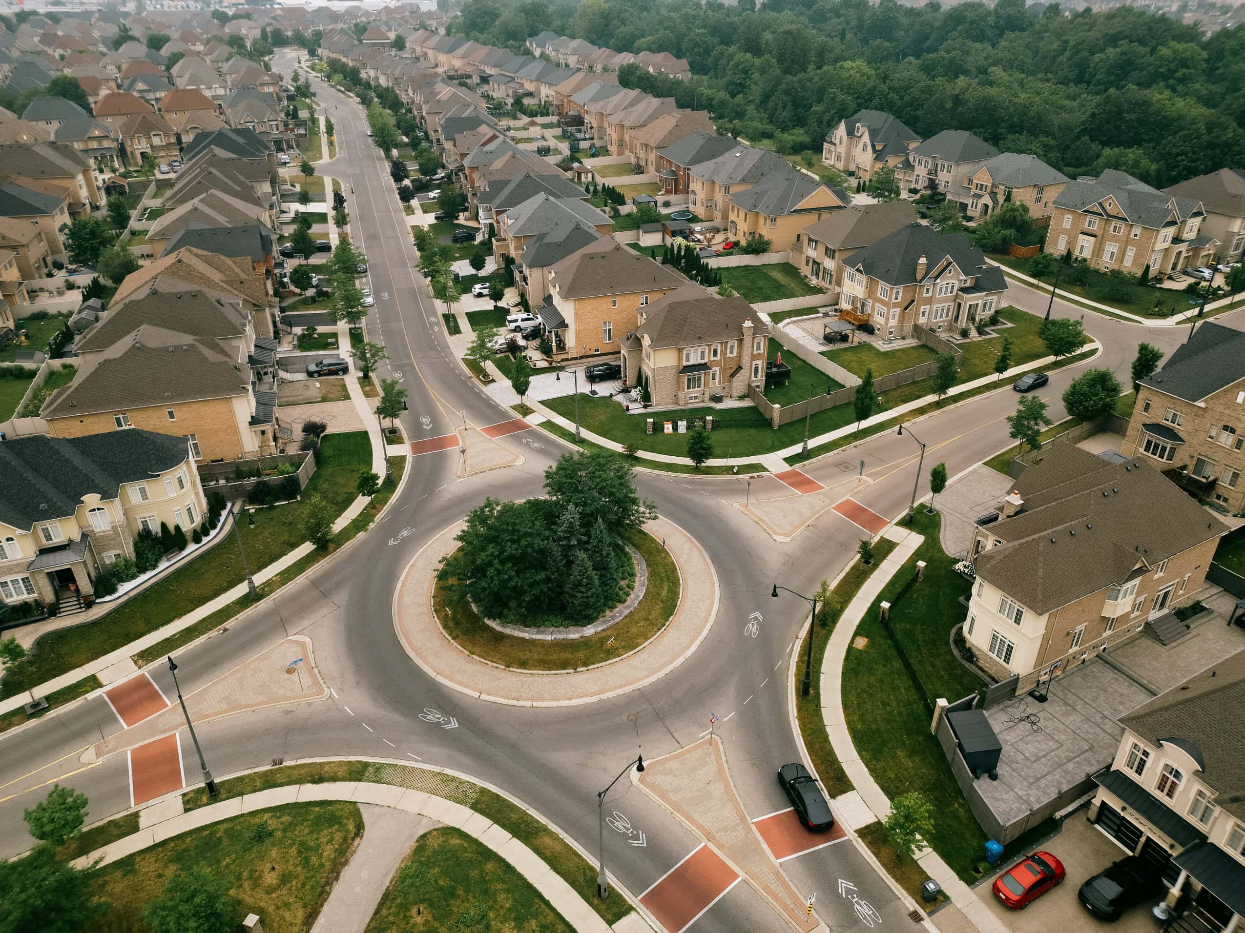An aerial view of a roundabout in a suburban neighbourhood in Brampton, Ontario.